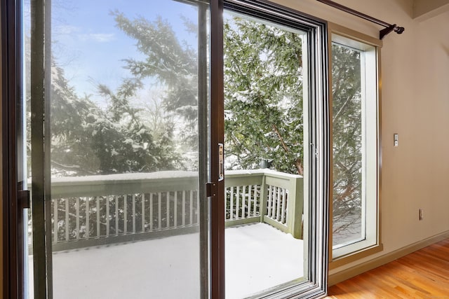 doorway to outside with hardwood / wood-style floors