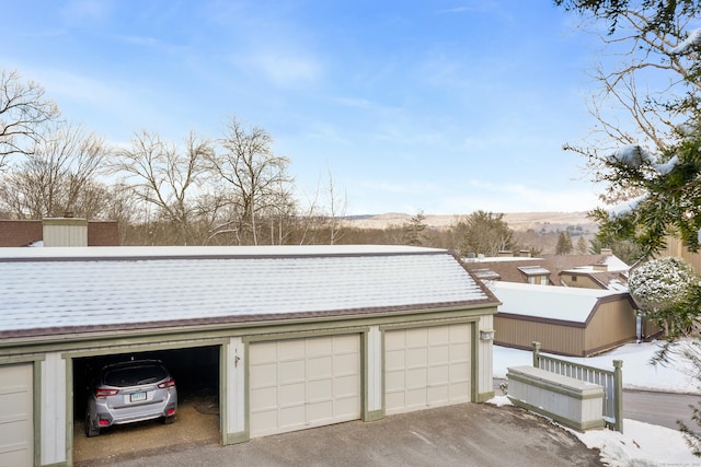 view of snow covered garage