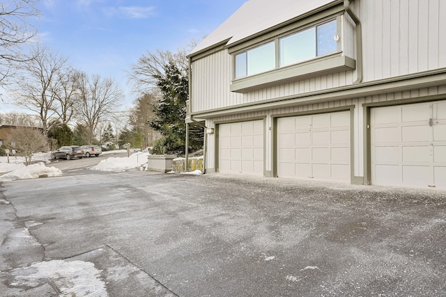 view of side of home with a garage