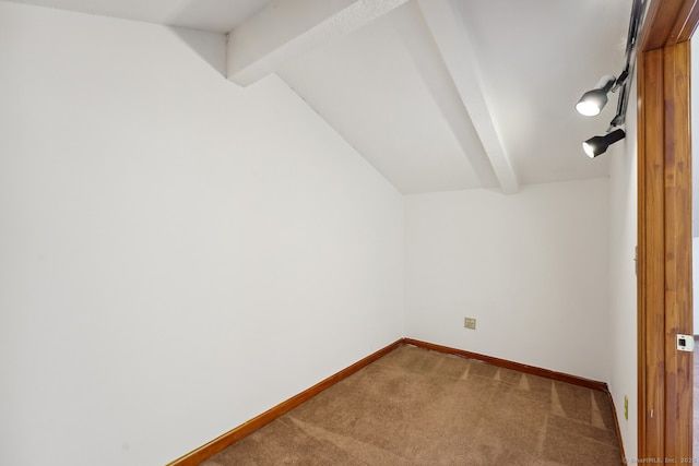 additional living space with lofted ceiling with beams, baseboards, and carpet floors