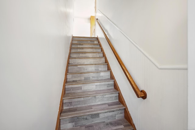 staircase featuring wood finished floors