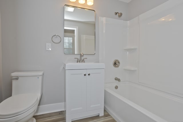 full bathroom featuring vanity, wood-type flooring, shower / tub combination, and toilet