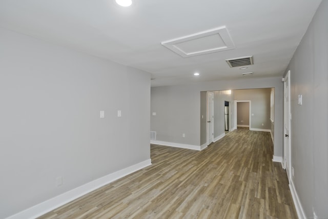 unfurnished room with light wood-type flooring