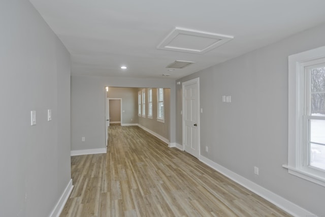 unfurnished room with light hardwood / wood-style flooring