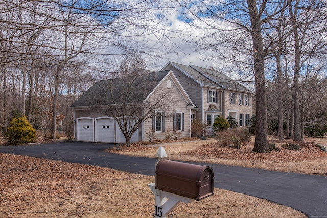 view of front of home featuring an attached garage and driveway