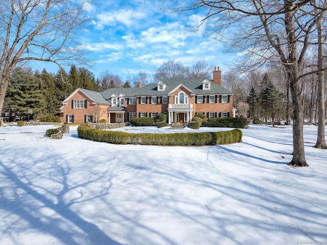 view of front of house featuring a chimney