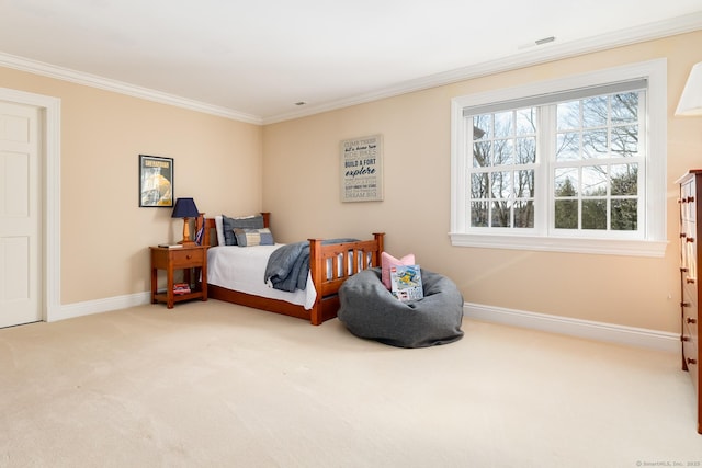 bedroom with ornamental molding, carpet, visible vents, and baseboards