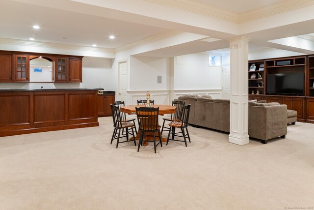 dining area with ornamental molding, recessed lighting, light carpet, and decorative columns