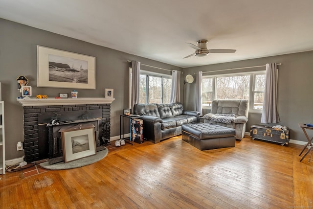 living room with hardwood / wood-style floors and ceiling fan