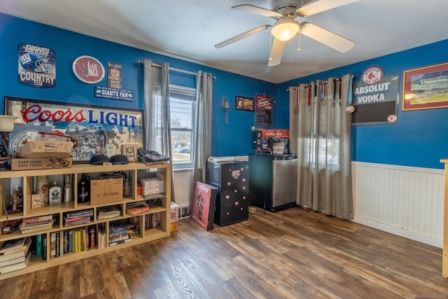 interior space featuring wood-type flooring and ceiling fan