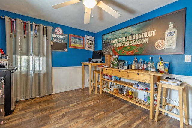 bar featuring hardwood / wood-style floors and ceiling fan