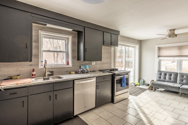 kitchen featuring sink, stainless steel appliances, a healthy amount of sunlight, and ceiling fan