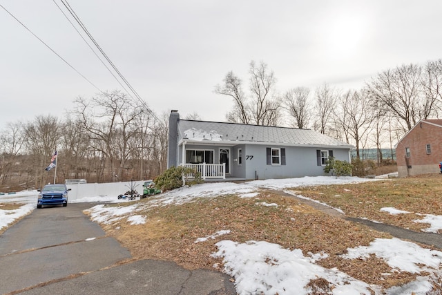 view of front of property featuring covered porch