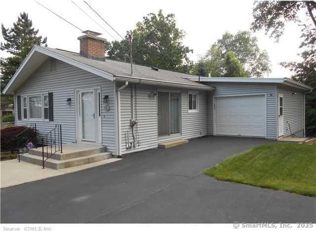 single story home with a garage