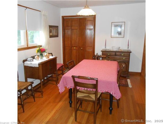 dining space featuring wood-type flooring