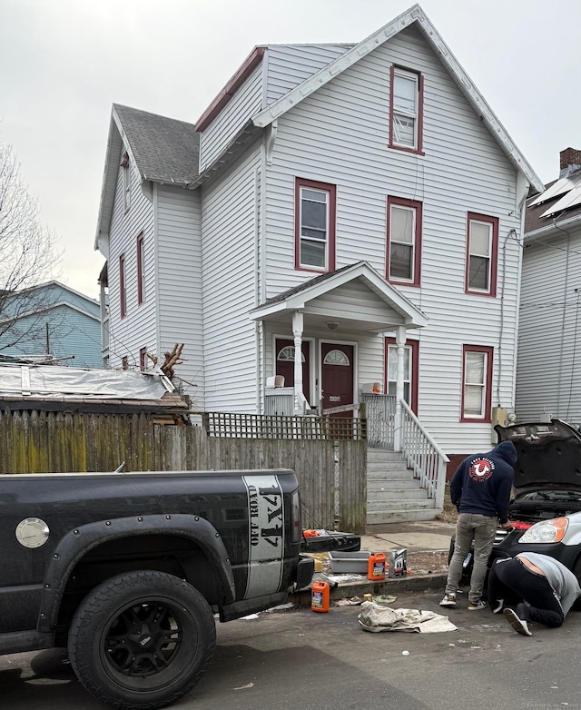 view of front of property featuring fence