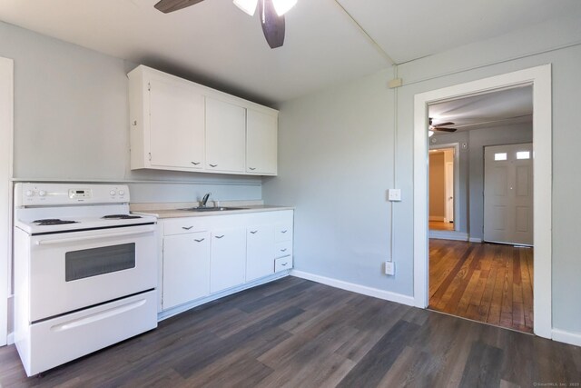 175 Main St, Winchester, CT 06098 - kitchen with white electric range oven, sink, white cabinetry, dark hardwood / wood-style flooring, and ceiling fan