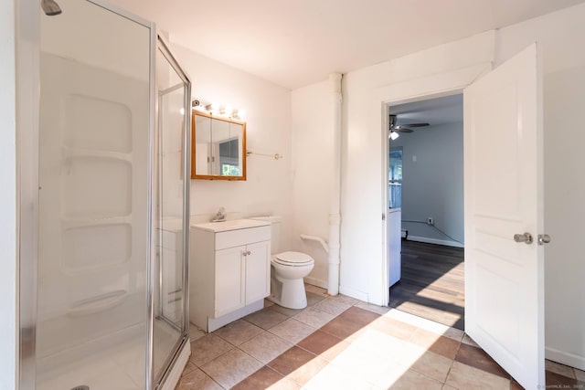 175 Main St, Winchester, CT 06098 - bathroom with a shower with door, ceiling fan, tile patterned flooring, vanity, and toilet