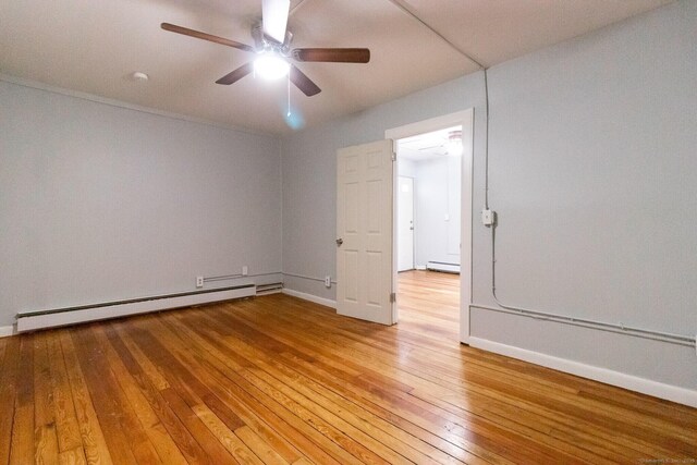 175 Main St, Winchester, CT 06098 - unfurnished room featuring a baseboard heating unit, hardwood / wood-style floors, and ceiling fan