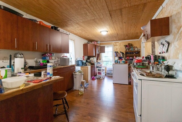 175 Main St, Winchester, CT 06098 - kitchen with hardwood / wood-style floors, a kitchen breakfast bar, fridge, white stove, and wooden ceiling