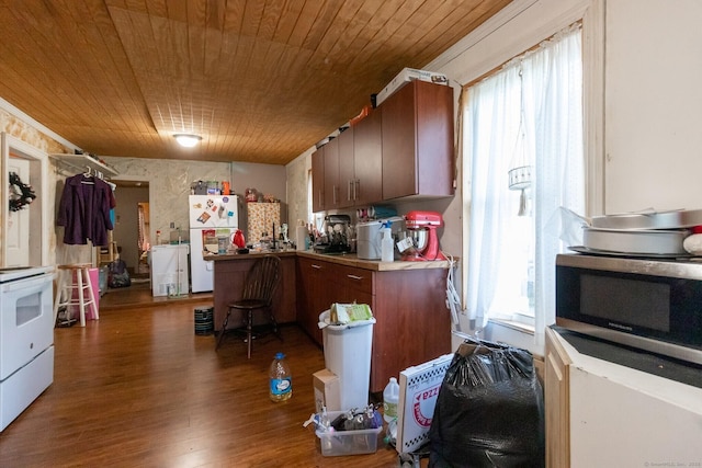 175 Main St, Winchester, CT 06098 - kitchen featuring dark wood-type flooring, wood ceiling, white appliances, and kitchen peninsula