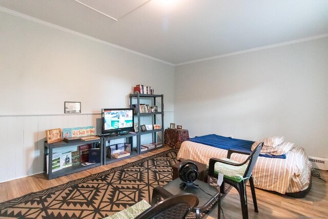 175 Main St, Winchester, CT 06098 - bedroom with ornamental molding, wood-type flooring, and a baseboard heating unit