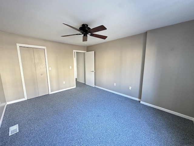 unfurnished bedroom with a closet, ceiling fan, and carpet flooring