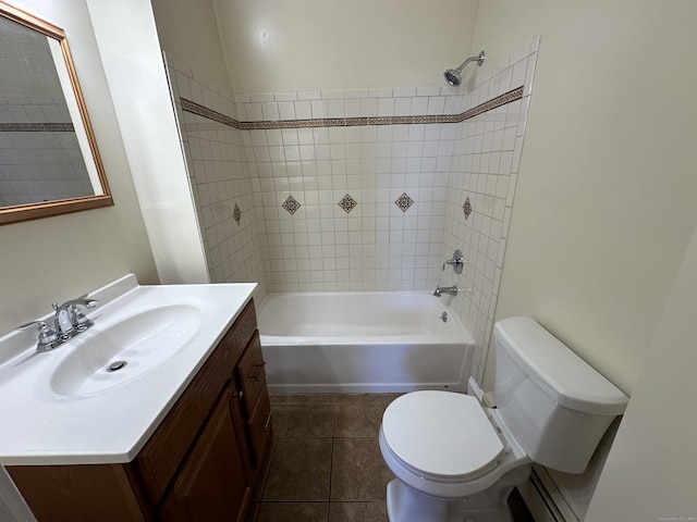 full bathroom with tile patterned floors, vanity, toilet, and tiled shower / bath combo