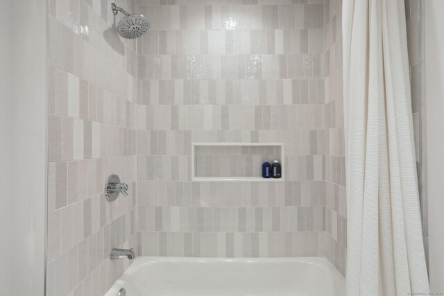 bathroom featuring shower / bath combination with curtain