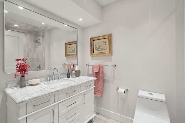 bathroom with vanity and toilet