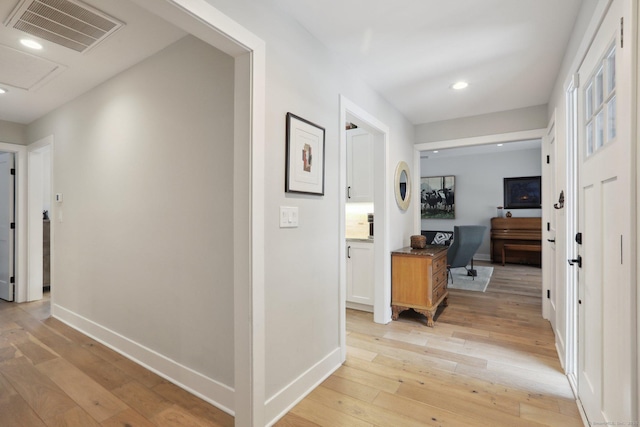 hallway with light wood-type flooring