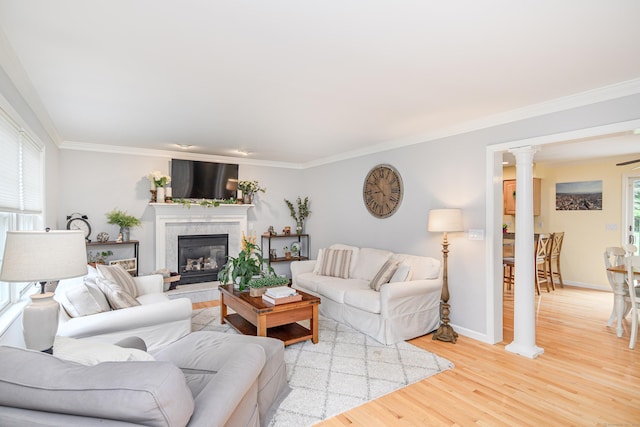 48 Bear Mountain Rd, Danbury, CT 06811 - living area with light wood-style floors, ornamental molding, a tile fireplace, and decorative columns
