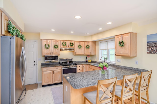 48 Bear Mountain Rd, Danbury, CT 06811 - kitchen featuring appliances with stainless steel finishes, light brown cabinets, a peninsula, under cabinet range hood, and recessed lighting