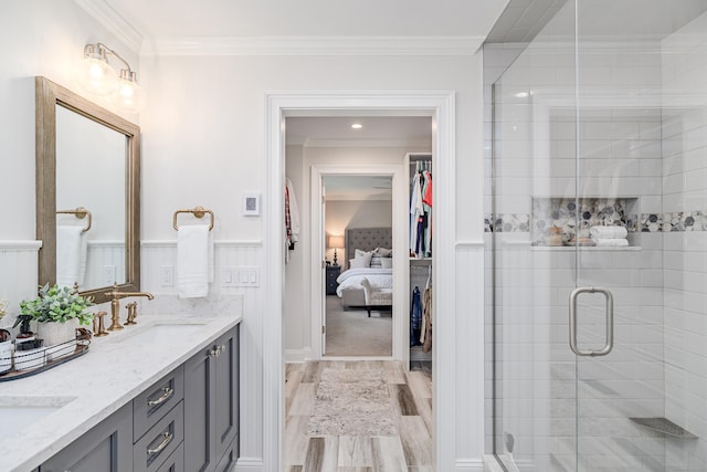 48 Bear Mountain Rd, Danbury, CT 06811 - full bath featuring double vanity, connected bathroom, a stall shower, crown molding, and marble finish flooring