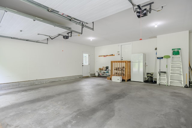48 Bear Mountain Rd, Danbury, CT 06811 - garage with freestanding refrigerator and a garage door opener