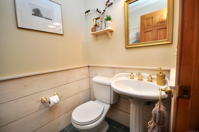 bathroom featuring tile patterned floors and toilet