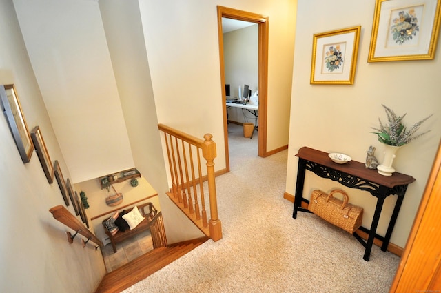 hallway featuring light carpet