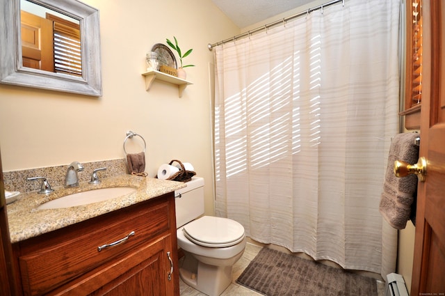 bathroom with vanity, tile patterned flooring, a baseboard radiator, and toilet