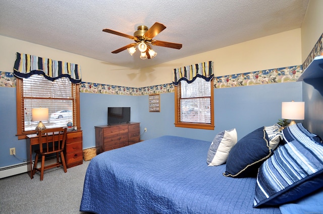 bedroom featuring multiple windows, ceiling fan, carpet floors, and a textured ceiling