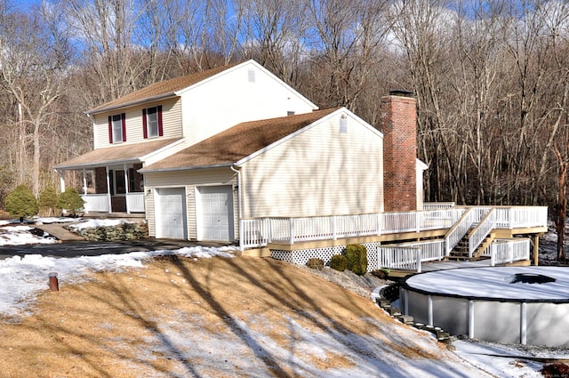 exterior space with a pool side deck