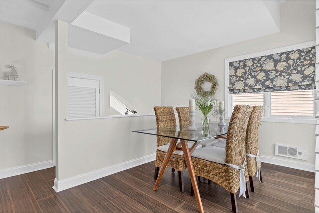 dining area featuring dark wood-type flooring