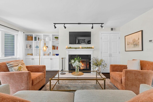 living room with dark hardwood / wood-style floors