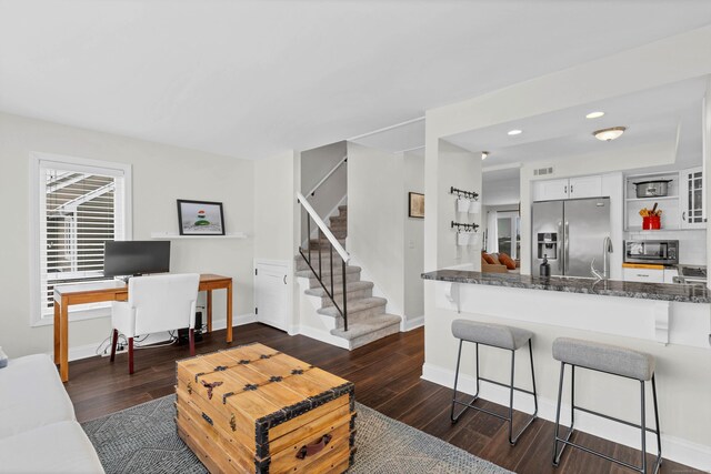 living room with dark wood-type flooring