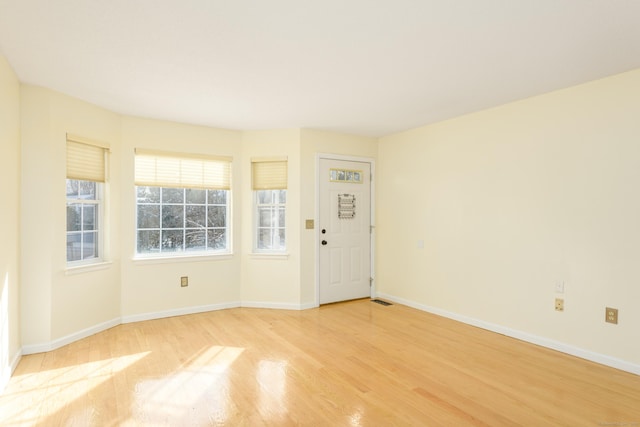 spare room with light wood-type flooring