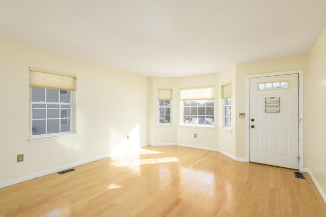 entryway with light hardwood / wood-style floors