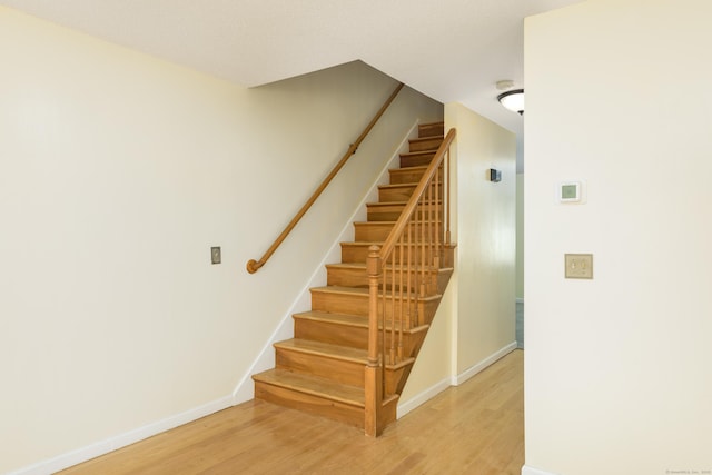 staircase featuring hardwood / wood-style floors