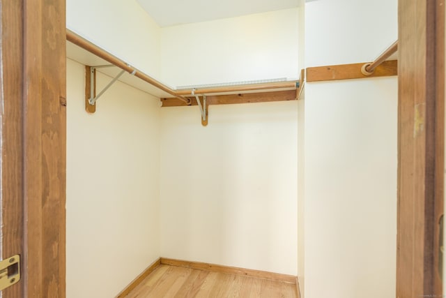 walk in closet featuring light wood-type flooring