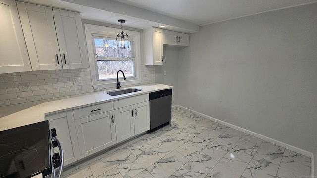 kitchen with white cabinetry, appliances with stainless steel finishes, sink, and pendant lighting