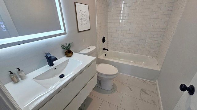 full bathroom with tiled shower / bath, vanity, and toilet