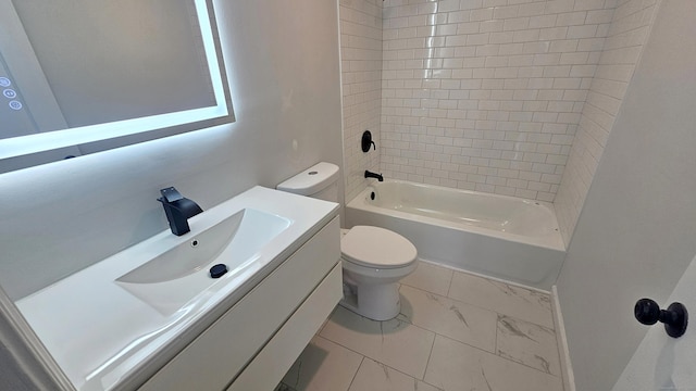 full bathroom featuring tiled shower / bath, vanity, and toilet